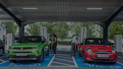red and green car charging at commerical ev charger station