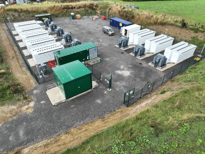 Tesla Megapack batteries placed in an open field
